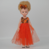 Poupée albinos fille robe orange
